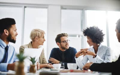 A group of employees holding a startup strategy meeting.