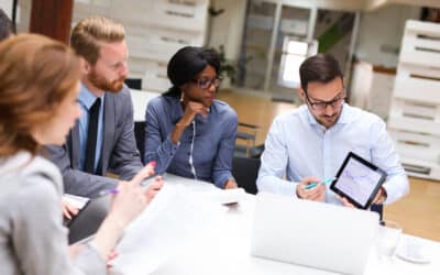 A group of HR employees analyzing HR data.